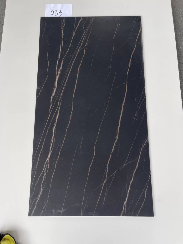 Sintered stone slab black gold pattern