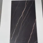 Sintered stone slab black gold pattern detail