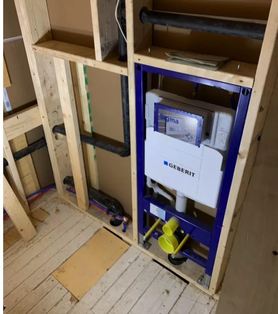toilet framed into wall