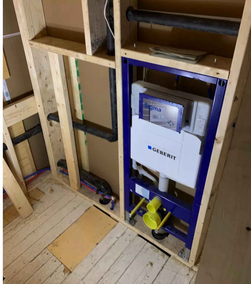 toilet framed into wall