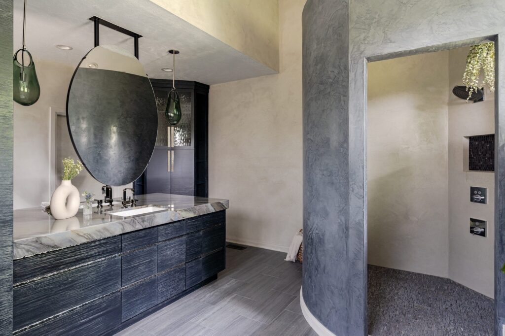 bathroom featuring natural stone walls