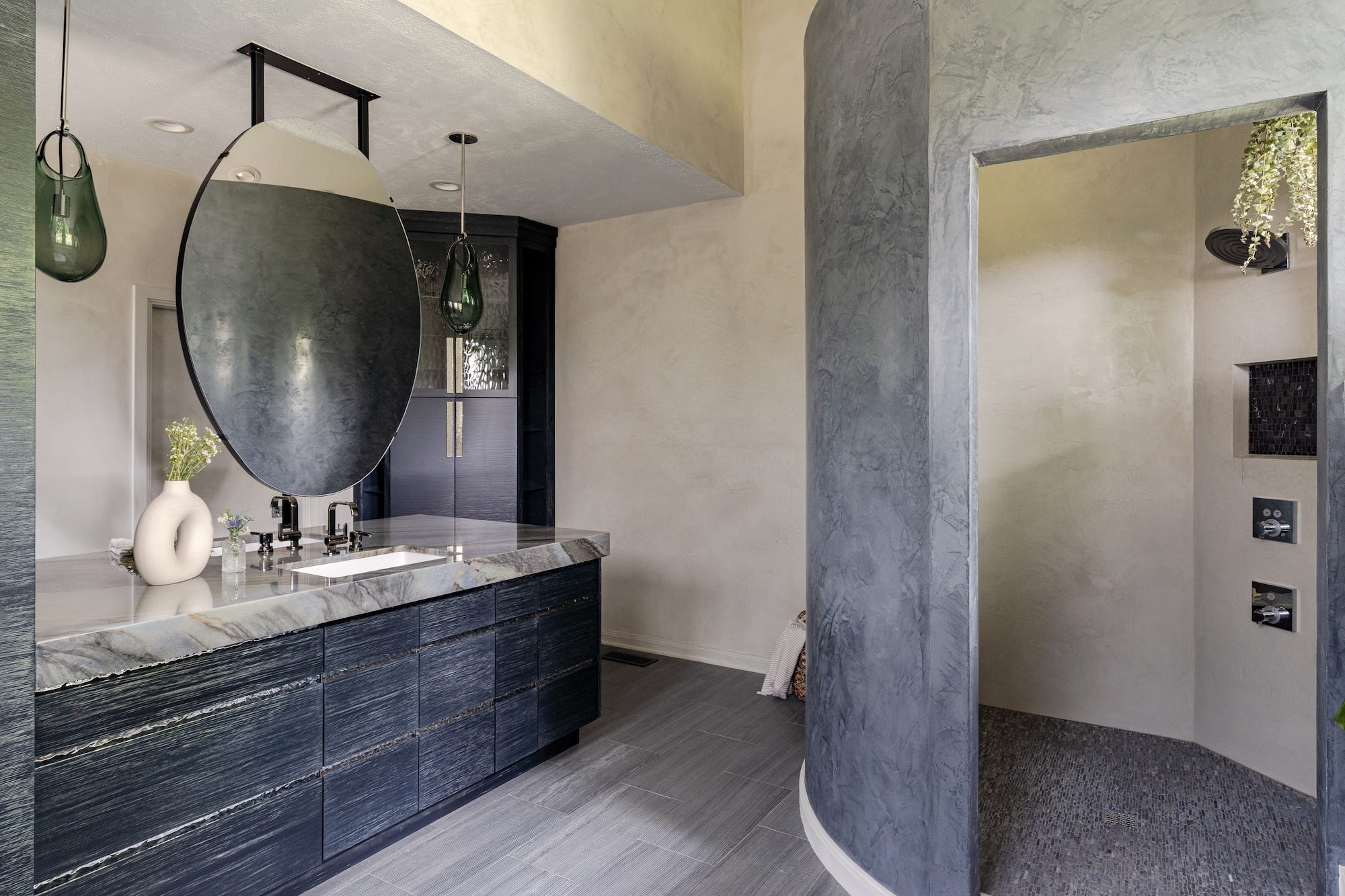 bathroom featuring natural stone walls